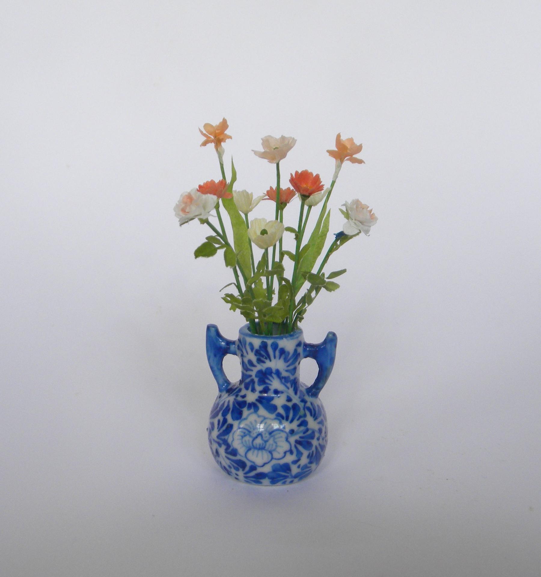 Bouquet orange vase bleu