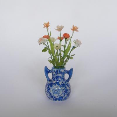 Bouquet orange vase bleu